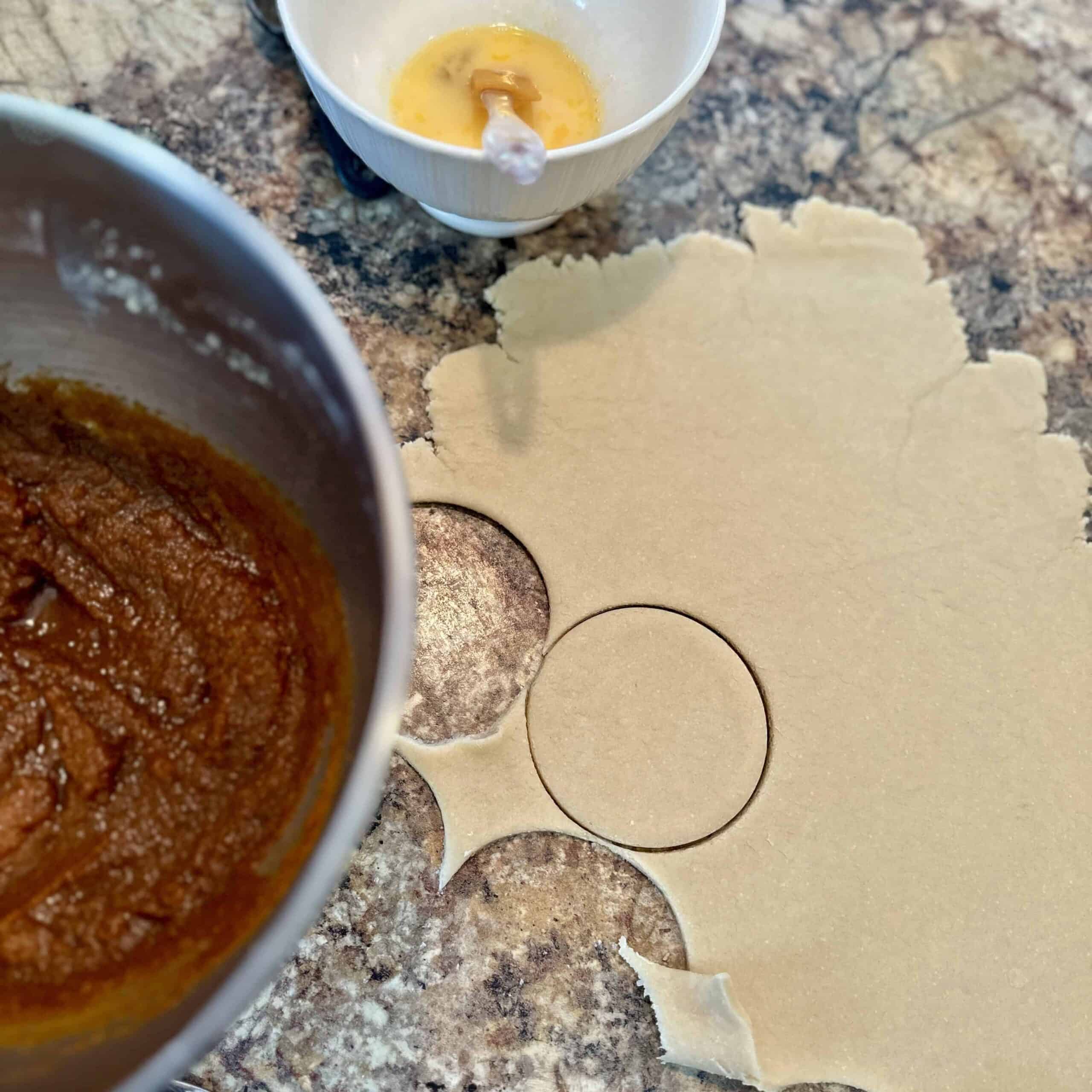 Cutting out hand pie crust for pumpkin pasties