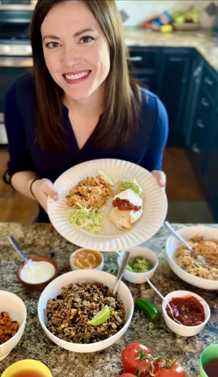baked fajita chimichangas with sour cream, salsa and guacamole on top